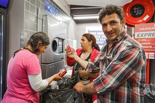 Homeless Romani Vasile Nihai explains how he earns his keep by salvaging bottles in Helsinki. 12.08.2014
